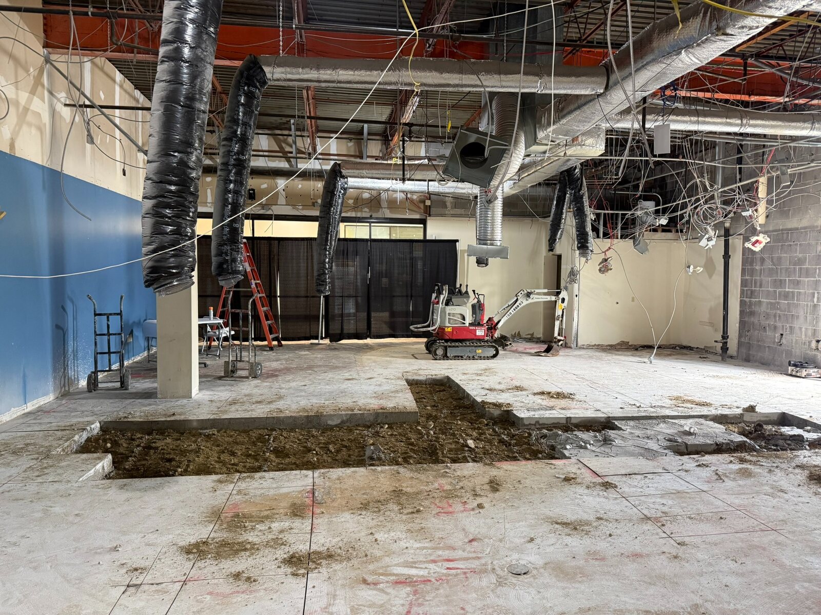 Wide view of floor trenching during construction