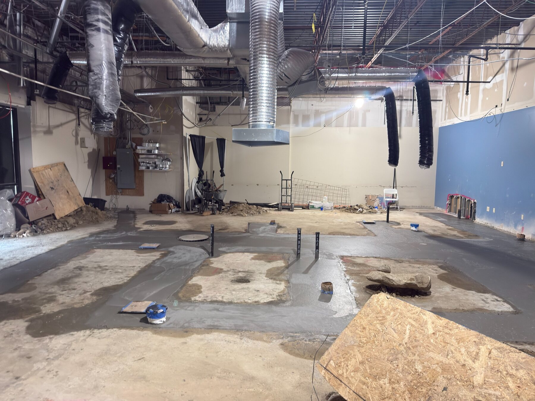 Restaurant floor after the underground plumbing and electrical inspection passed