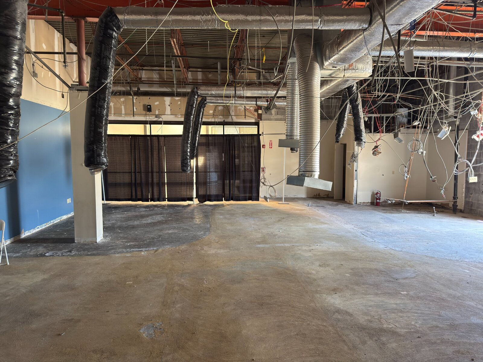 Wide view of early demolition inside the restaurant space